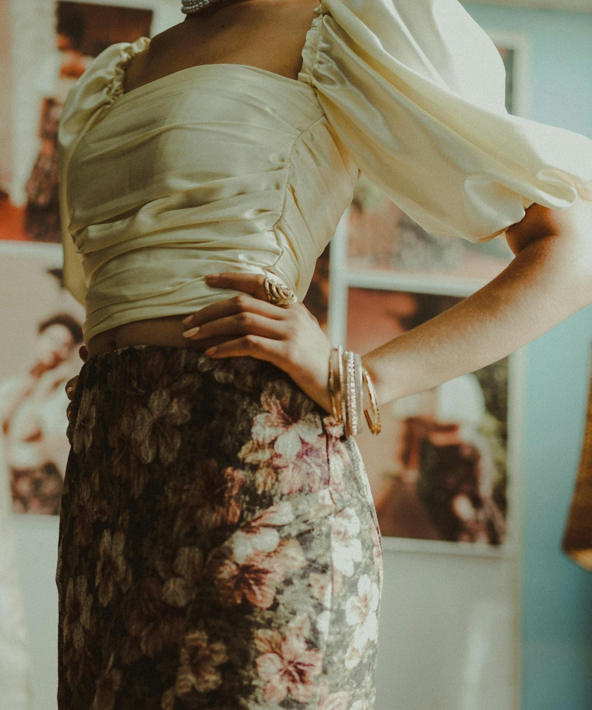 woman in white square-neck crop top and brown and pink floral miniskirt