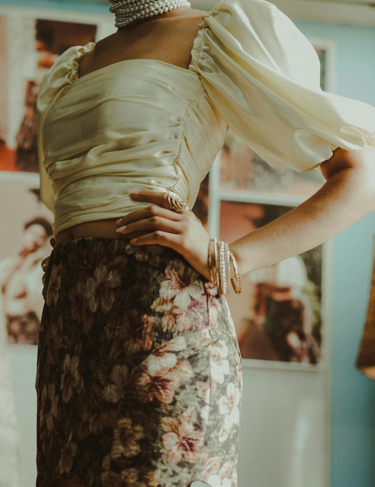 woman in white square-neck crop top and brown and pink floral miniskirt
