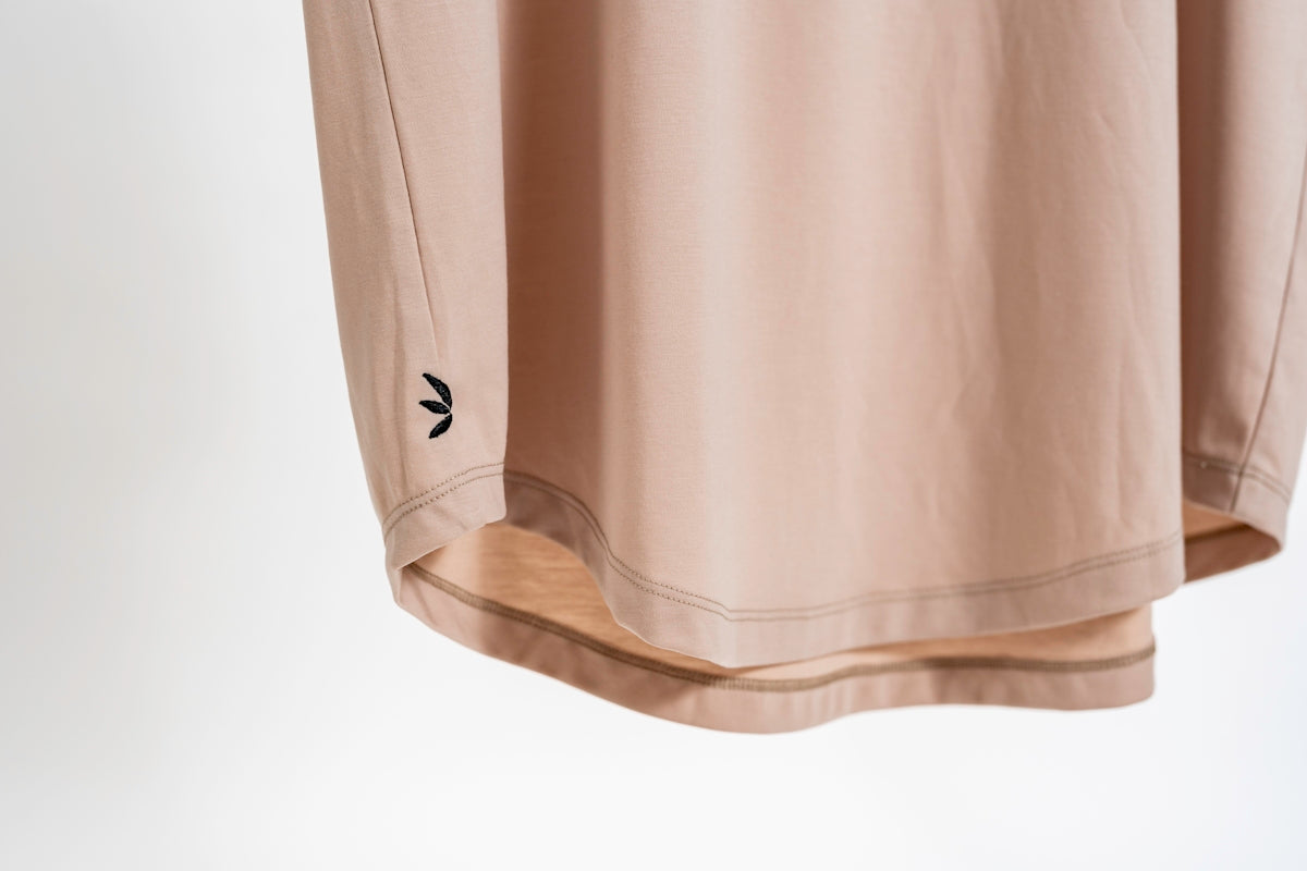 a white hat with a black logo