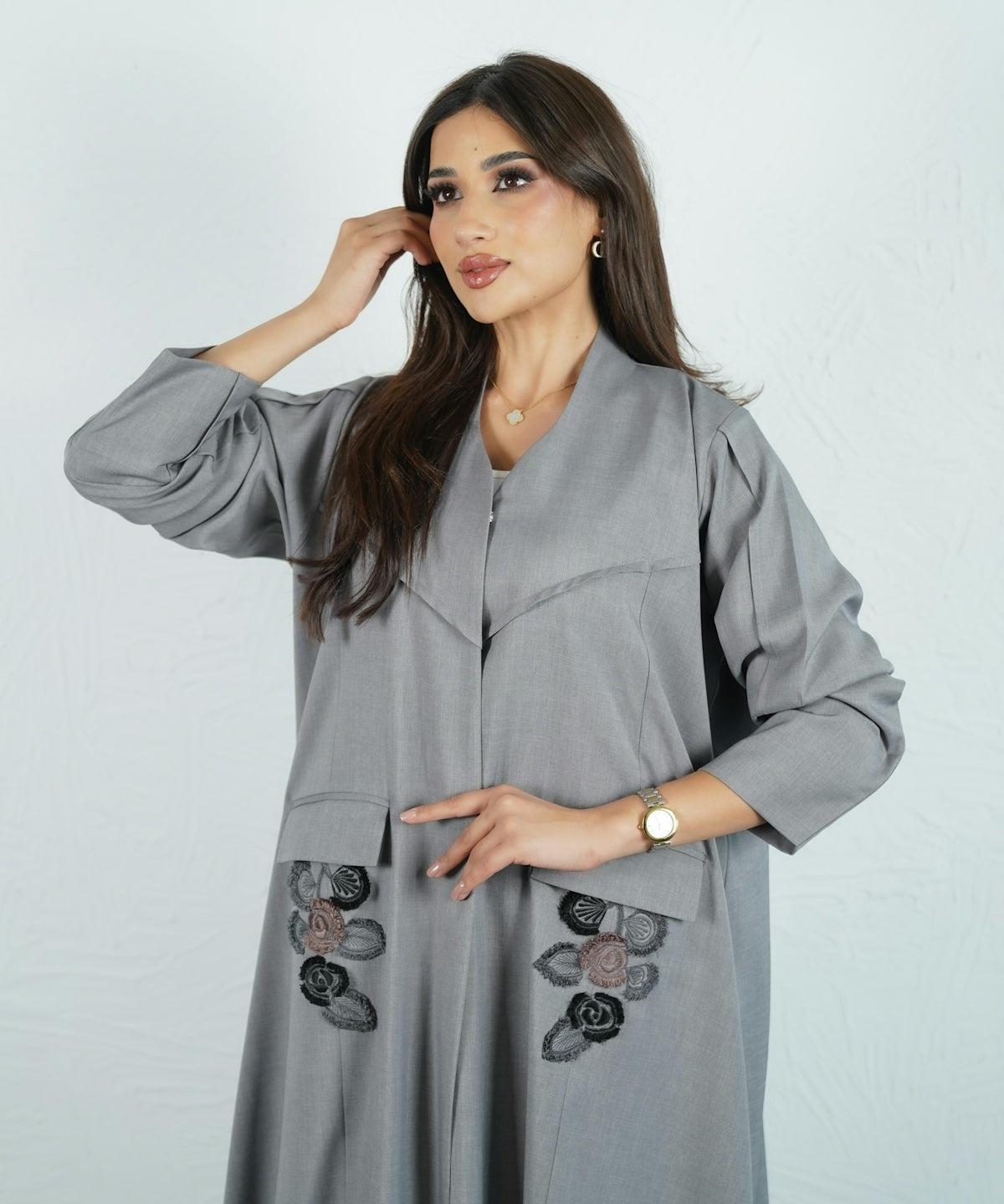 Woman wearing a stylish gray abaya.