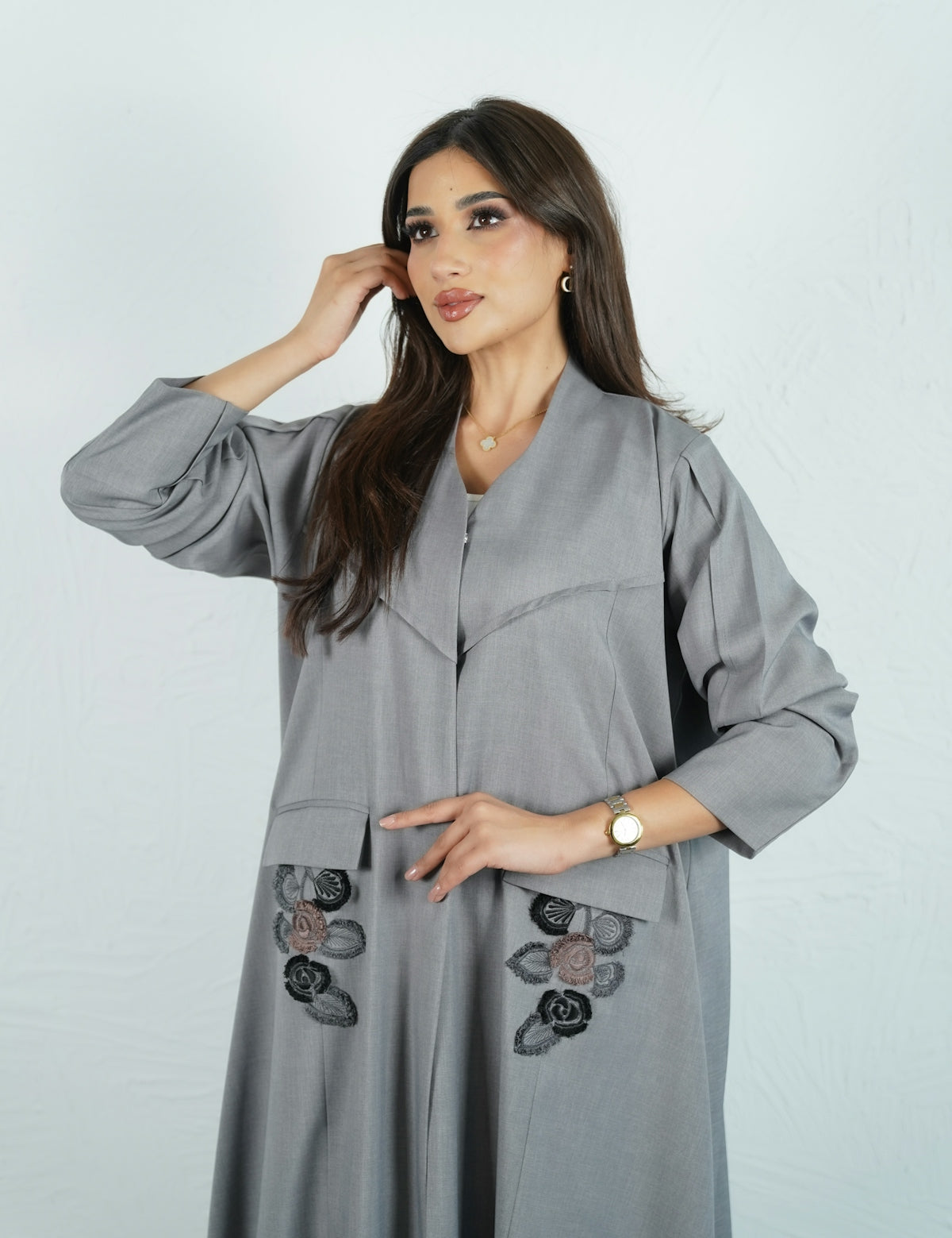Woman wearing a stylish gray abaya.